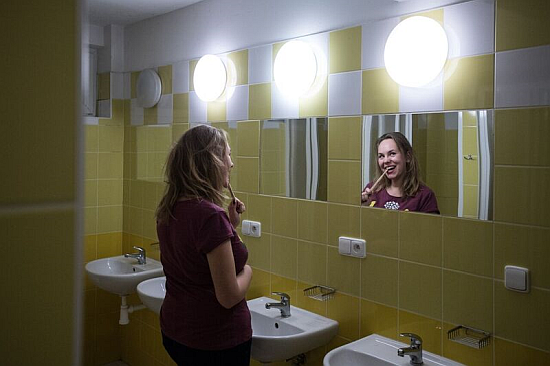 Ieva in one of Větrník's renovated bathrooms. Photo: René Volfík.