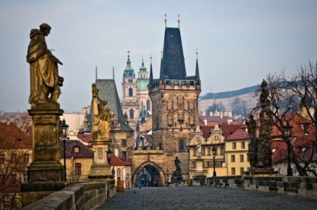 Source: Shutterstock. Photographer: Daniel Korzeniewski. View of the Lesser Bridge Tower of Charles Bridge in Prague.